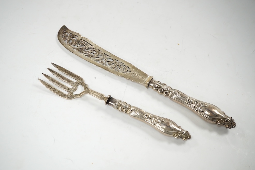 A cased pair of Victorian silver fish servers, John Gilbert?, Birmingham, 1866, knife 31.5cm. Condition - poor